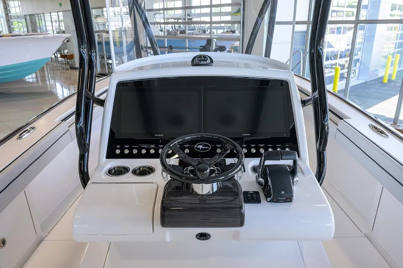 Slide: The Image of 2025 Valhalla Boatworks V-29 helm with dual screens and modern controls. - 23