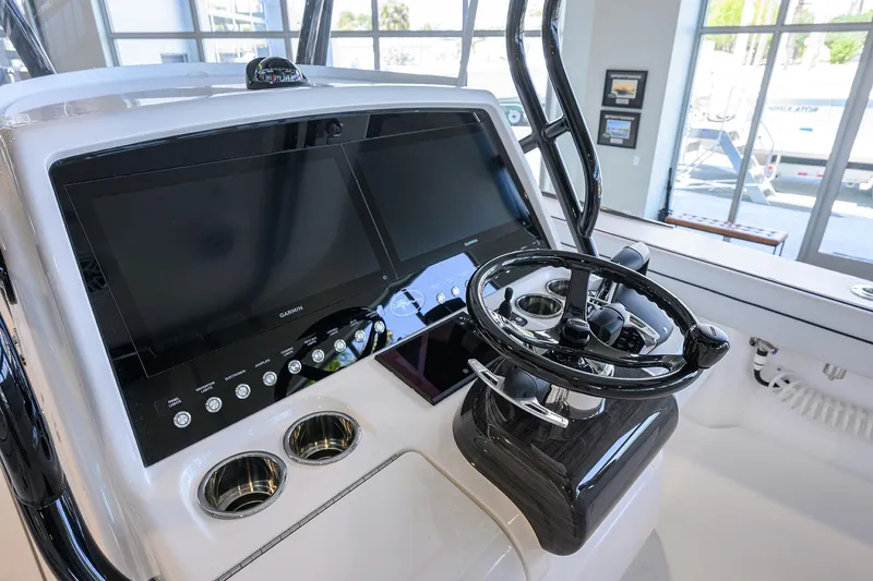 Slide: The Image of 2025 Valhalla Boatworks V-29 helm with modern controls and dual screens. - 24