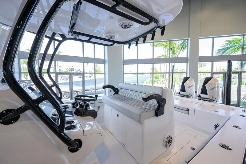 Slide: The Image of 2025 Valhalla Boatworks V-29 interior with modern seating and controls in a showroom. - 28
