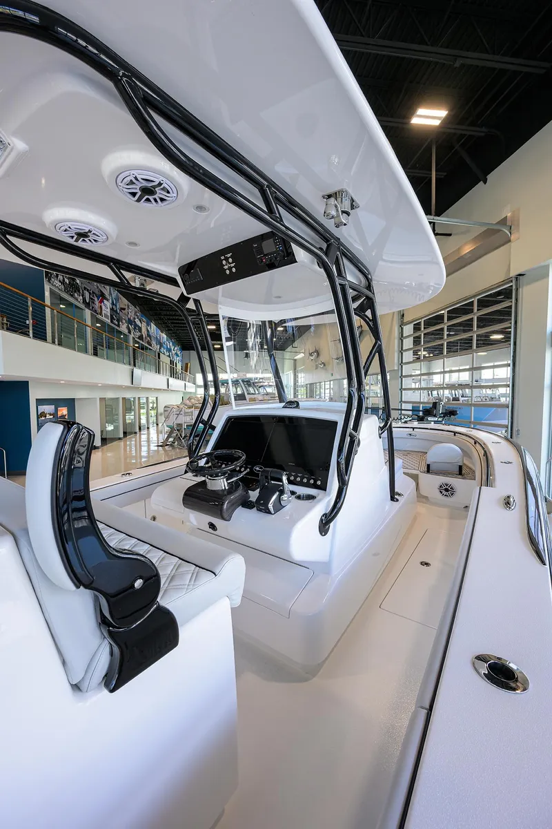 Slide: The Image of 2025 Valhalla Boatworks V-29 interior with modern helm and seating in showroom. - 31