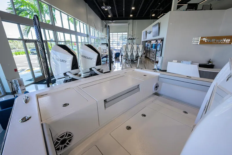 Slide: The Image of 2025 Valhalla Boatworks V-29 interior with Mercury engines in showroom setting. - 35