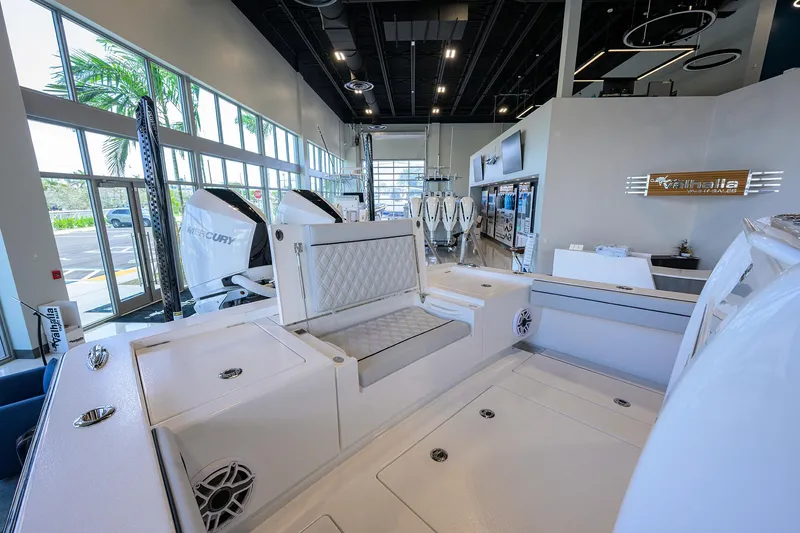 Slide: The Image of 2025 Valhalla Boatworks V-29 interior, showcasing sleek design and modern features in a showroom setting. - 37