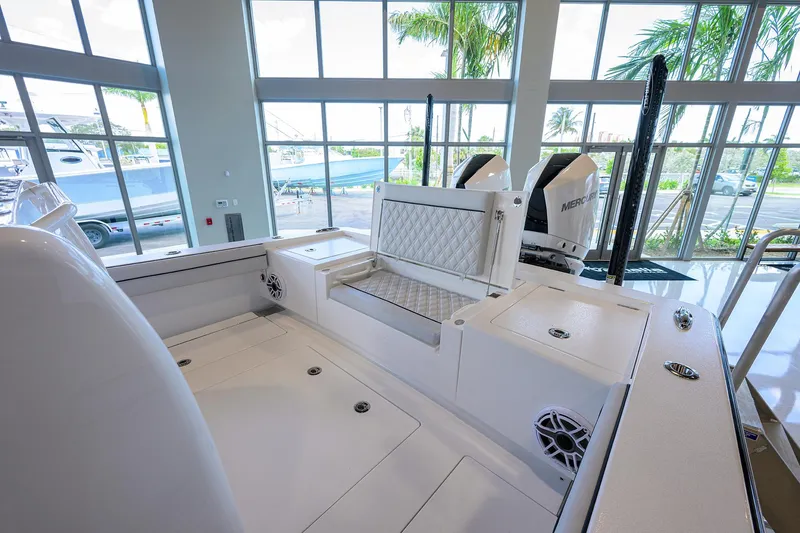 Slide: The Image of 2025 Valhalla Boatworks V-29 interior with modern seating and dual engines in a showroom. - 38