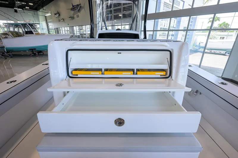 Slide: The Image of 2025 Valhalla Boatworks V-29 interior storage compartments in a showroom setting. - 43