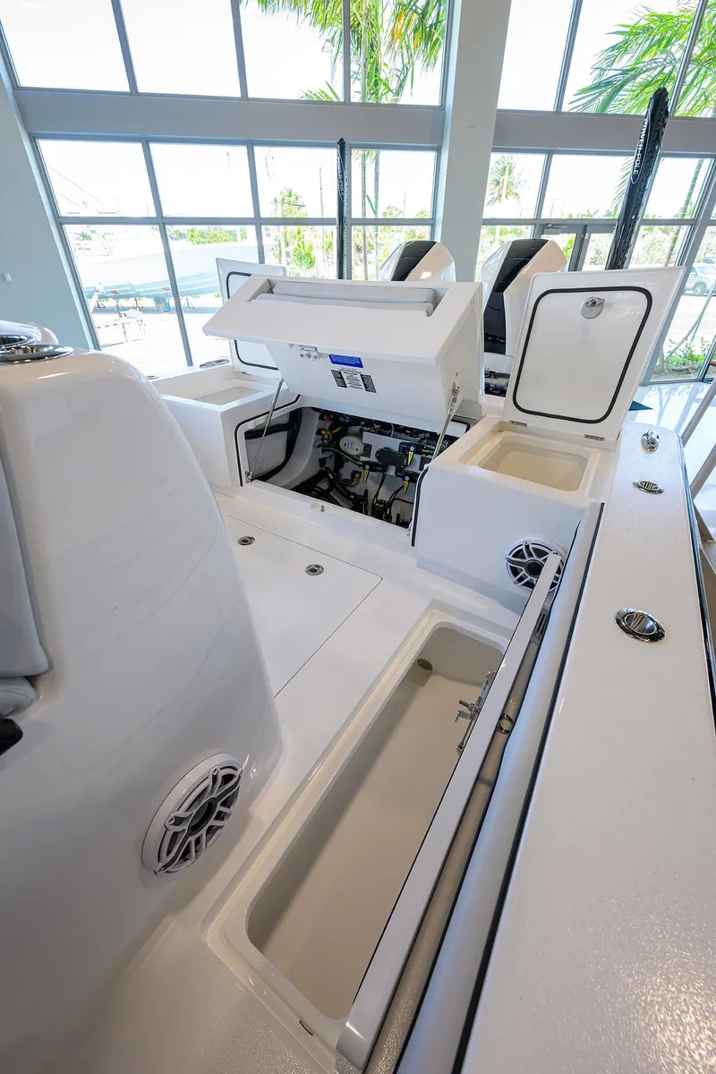 Slide: The Image of 2025 Valhalla Boatworks V-29 interior with open storage compartments and modern design. - 46