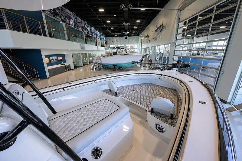 Slide: The Image of 2025 Valhalla Boatworks V-29 displayed in a modern showroom with sleek interior design. - 6