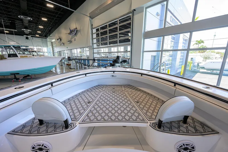 Slide: The Image of 2025 Valhalla Boatworks V-29 interior with sleek design and modern seating in showroom. - 8