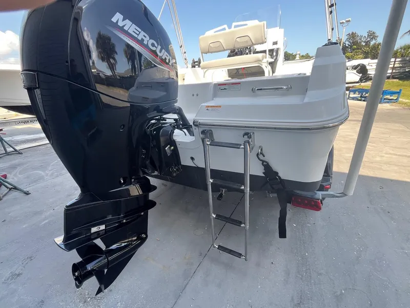 Slide: The Image of 2022 Wellcraft 202 Fisherman boat with Mercury outboard motor and ladder. - 3