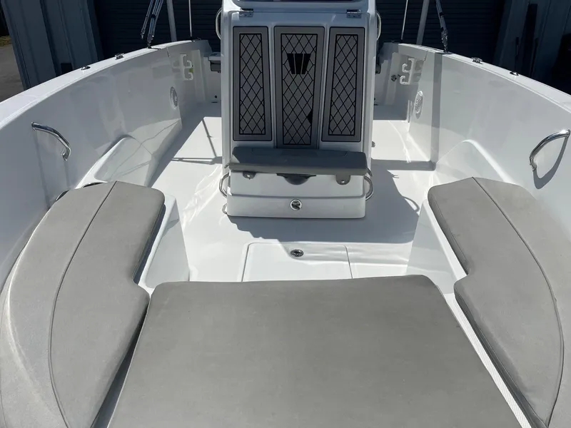 Slide: The Image of 2022 Wellcraft 202 Fisherman boat interior with cushioned seating and storage compartments. - 5