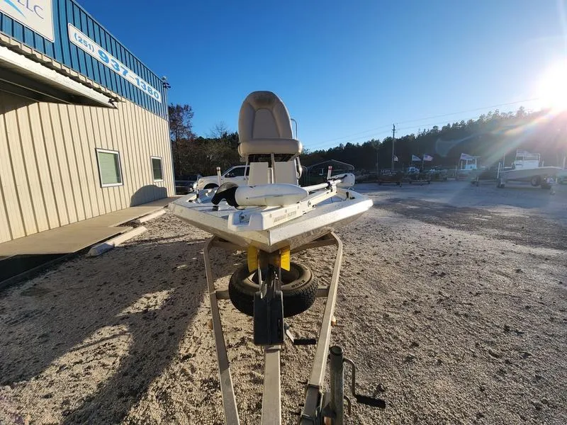 Slide: The Image of 2015 Xpress Hyper-Lift Bay Series H18B boat on trailer, sunny outdoor setting. - 1