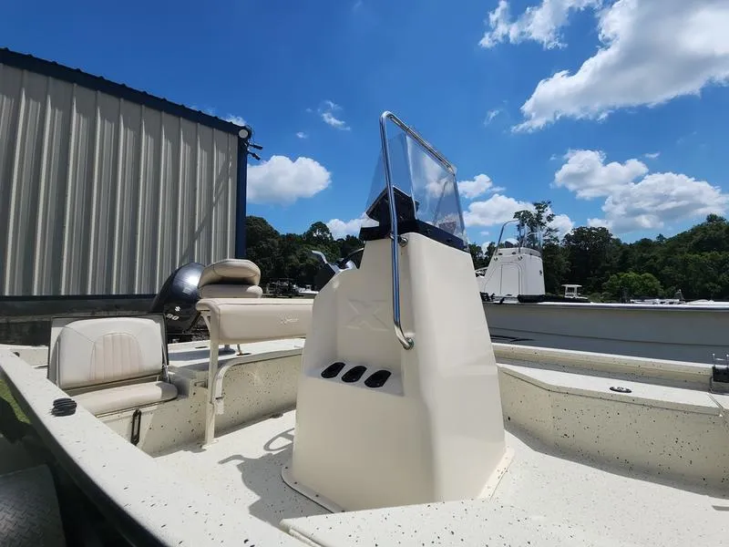 Slide: The Image of 2015 Xpress Hyper-Lift Bay Series H18B boat under a clear blue sky. - 18
