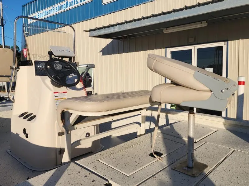 Slide: The Image of 2015 Xpress Hyper-Lift Bay Series H18B boat with beige seating and control console. - 20