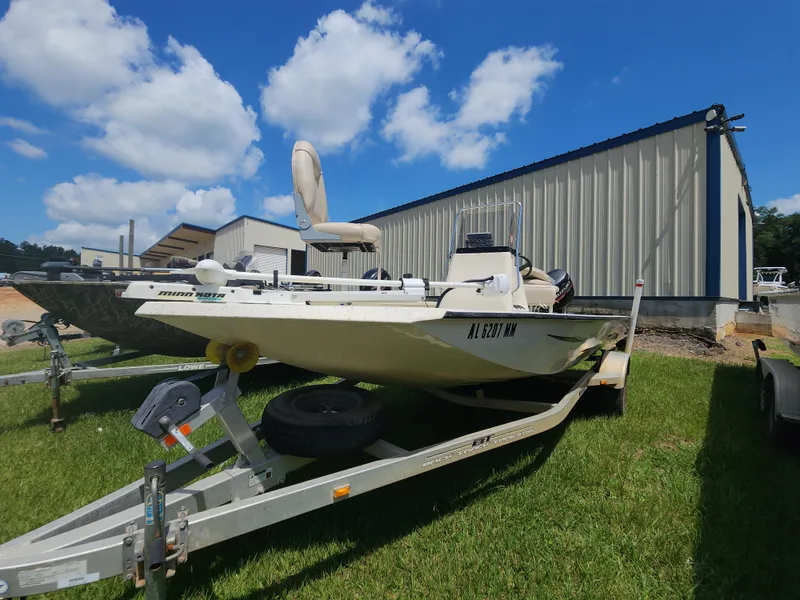 Slide: The Image of 2015 Xpress Hyper-Lift Bay Series H18B boat on trailer, parked on grass, under blue sky. - 6