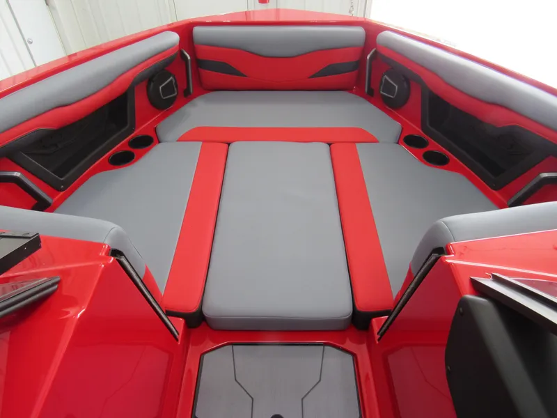 Slide: The Image of 2024 Axis T235 boat interior with red and gray seating, cup holders, and modern design. - 10