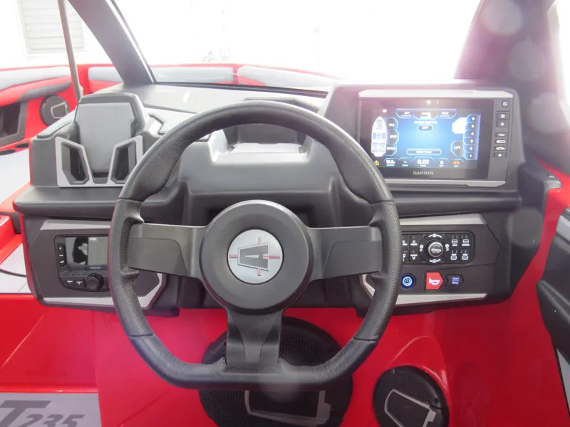 Slide: The Image of 2024 Axis T235 dashboard with steering wheel and touchscreen display. - 8