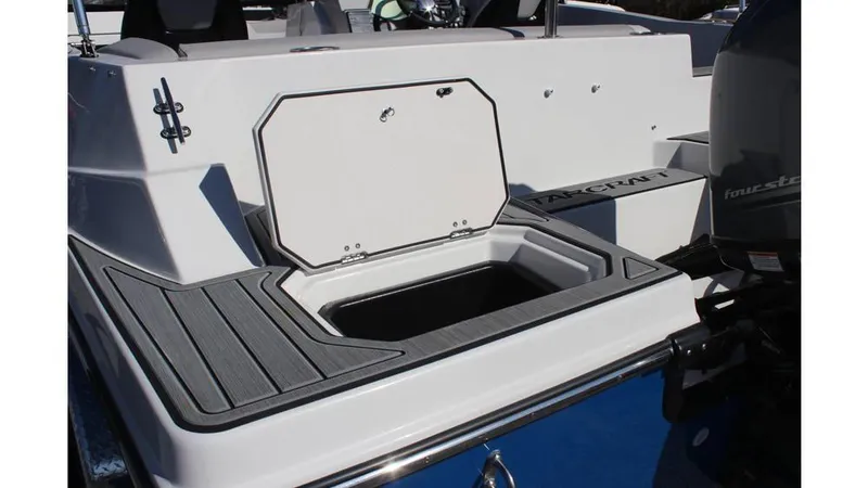 Slide: The Image of 2025 Starcraft SVX 190 OB DC boat with open storage compartment on deck. - 14