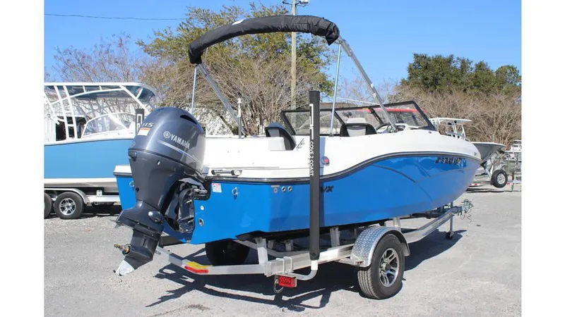 Slide: The Image of 2025 Starcraft SVX 190 OB DC boat with Yamaha outboard motor on trailer. - 4