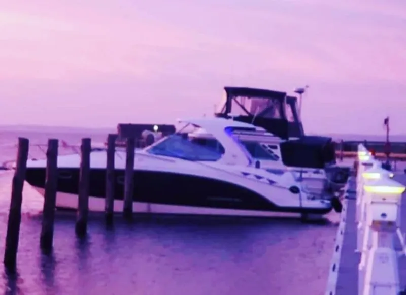 Slide: The Image of Chaparral 330 Signature Cruiser 2014 docked at sunset with a purple sky. - 6