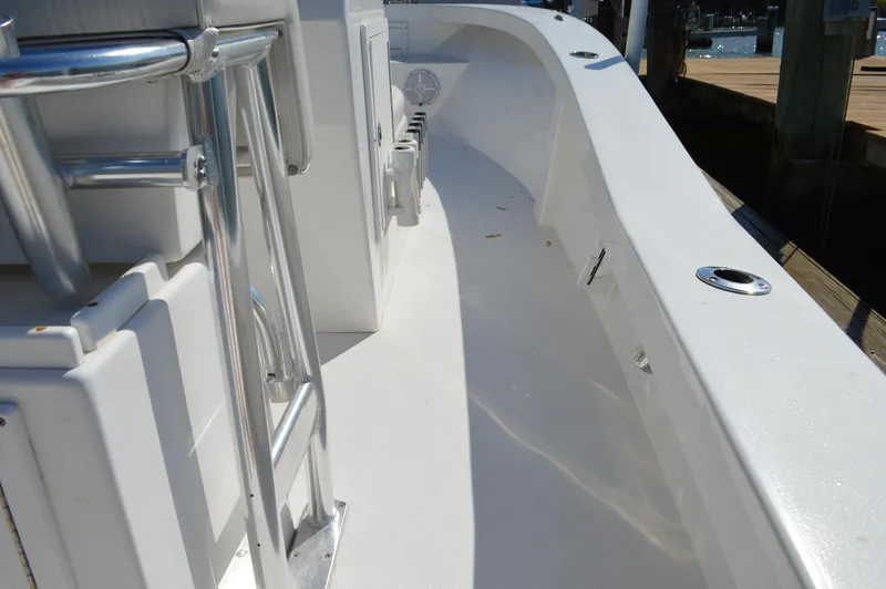 Slide: The Image of 2016 Layton Bay 22 boat deck with sleek white finish and stainless steel fittings. - 26