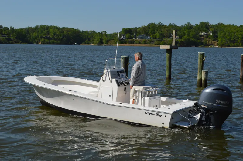 Slide: The Image of 2016 Layton Bay 22 boat on water with Yamaha outboard motor. - 3