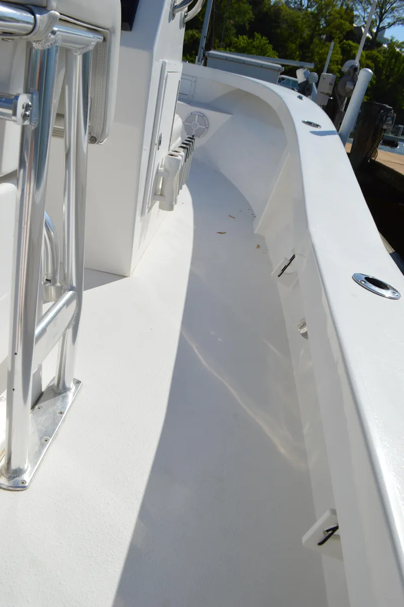 Slide: The Image of 2016 Layton Bay 22 boat deck with sleek white design and stainless steel fittings. - 31