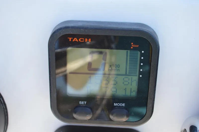 Slide: The Image of Digital tachometer display on a 2016 Layton Bay 22 boat dashboard. - 32