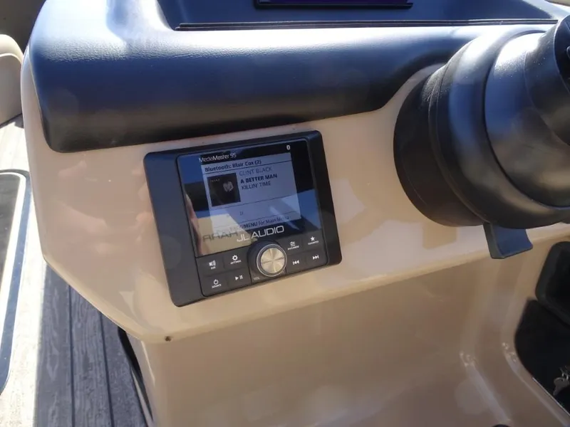 Slide: The Image of 2025 Harris Sunliner 250 boat dashboard with Fusion Audio system display. - 17