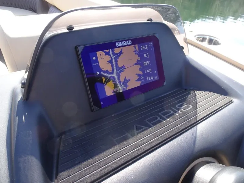 Slide: The Image of Dashboard of 2025 Harris Sunliner 250 with Simrad navigation display. - 18