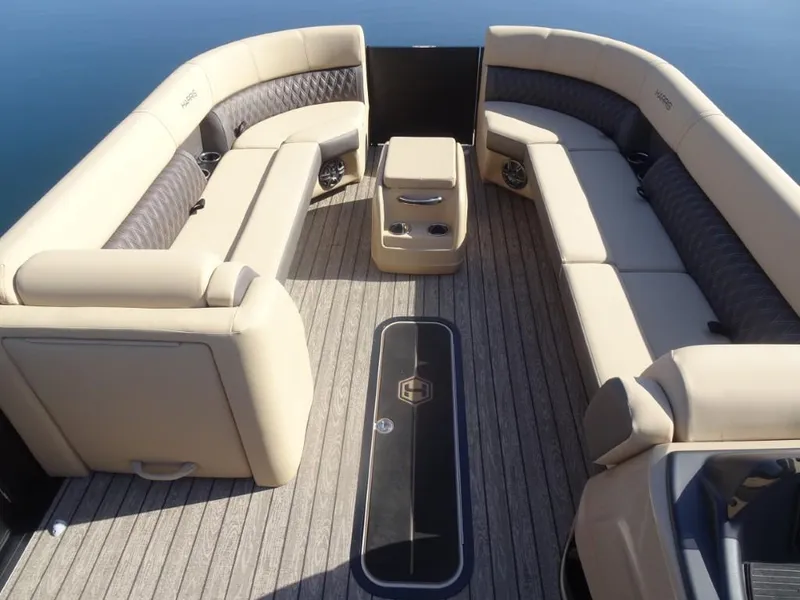 Slide: The Image of Luxurious 2025 Harris Sunliner 250 pontoon boat interior with plush seating and elegant design. - 22