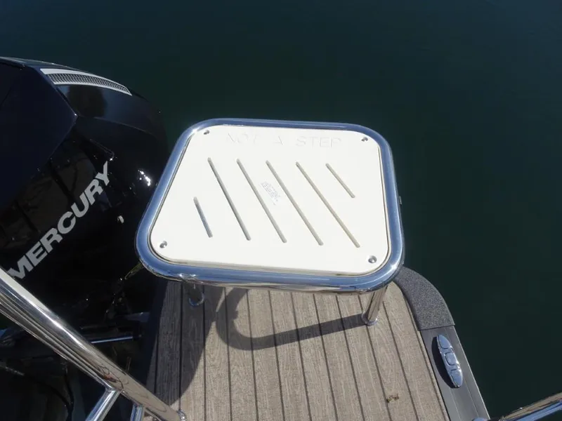Slide: The Image of 2025 Harris Sunliner 250 boat platform with Mercury engine and non-slip step. - 8