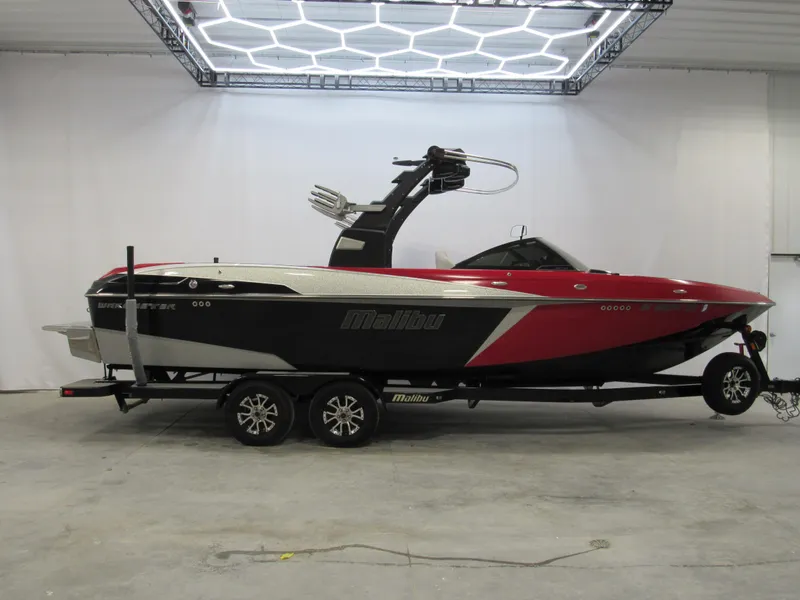 Slide: The Image of 2017 Malibu Wakesetter 25 LSV boat on trailer in indoor showroom. - 0