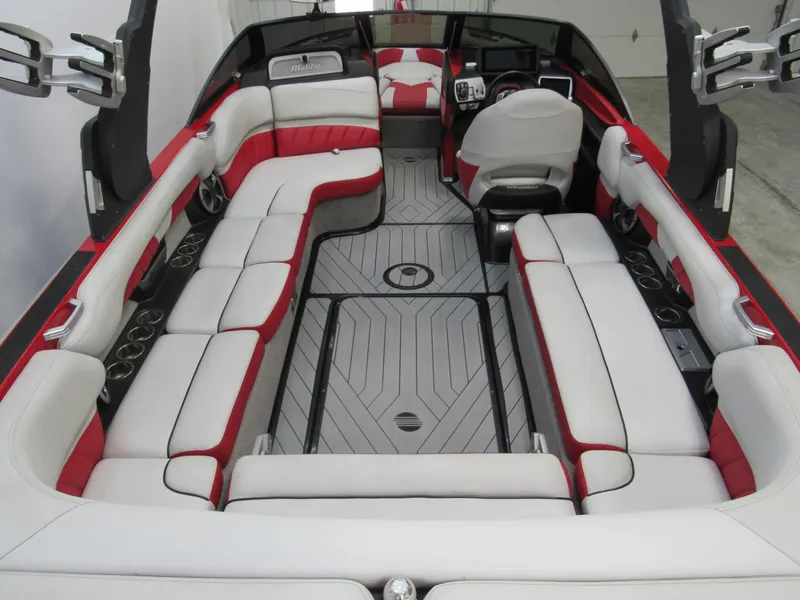 Slide: The Image of 2017 Malibu Wakesetter 25 LSV interior with red and white seating, spacious layout. - 3