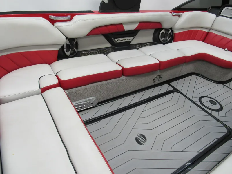 Slide: The Image of 2017 Malibu Wakesetter 25 LSV interior with red and white seating, modern design. - 4