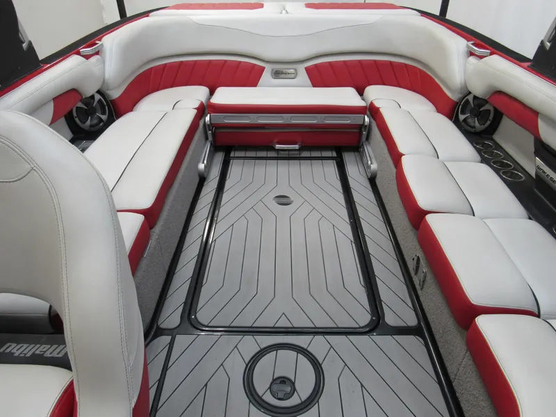Slide: The Image of 2017 Malibu Wakesetter 25 LSV interior with red and white seating, spacious layout. - 8