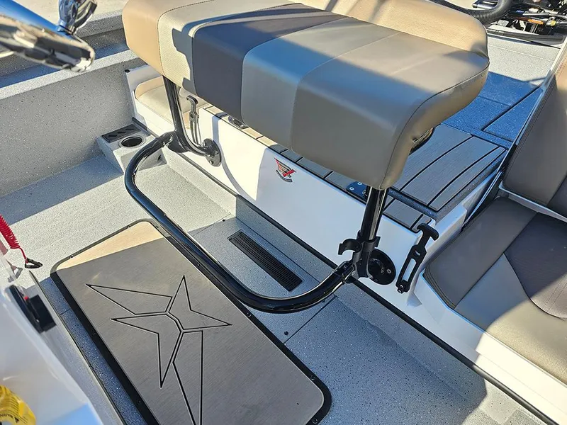 Slide: The Image of 2025 Vexus ACX2150 boat interior with cushioned seating and star-patterned flooring. - 14