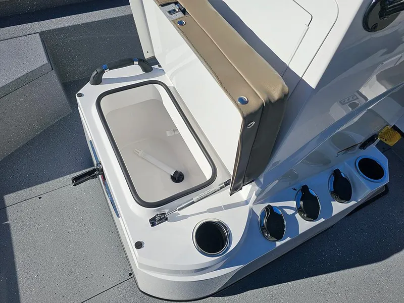 Slide: The Image of 2025 Vexus ACX2150 boat interior with open storage compartment and cup holders. - 17