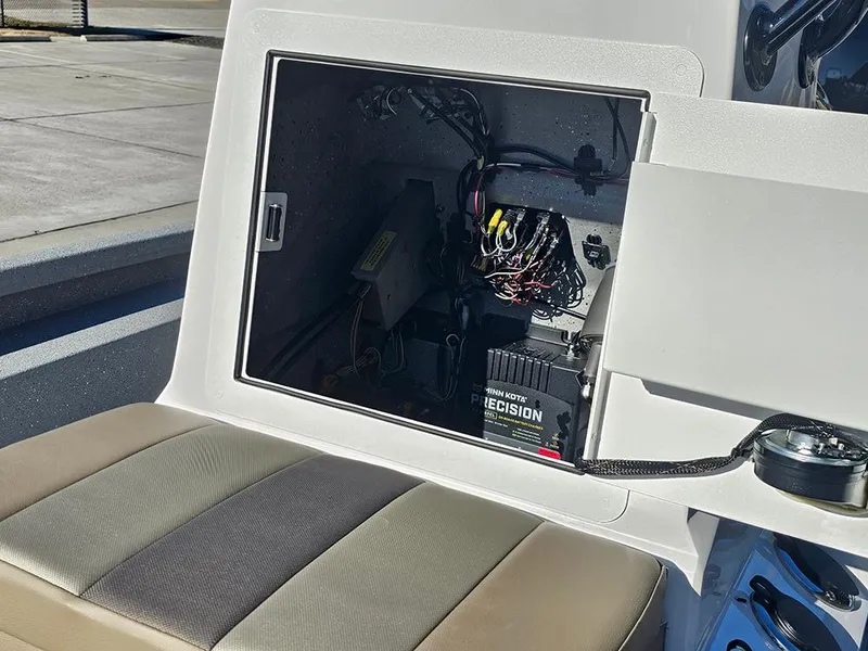 Slide: The Image of Open compartment of 2025 Vexus ACX2150 boat showing wiring and battery system. - 18