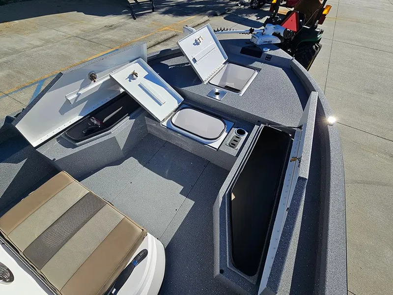 Slide: The Image of 2025 Vexus ACX2150 boat interior with open storage compartments and seating. - 20