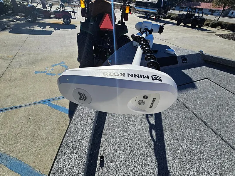 Slide: The Image of 2025 Vexus ACX2150 boat with Minn Kota trolling motor on a sunny day. - 21