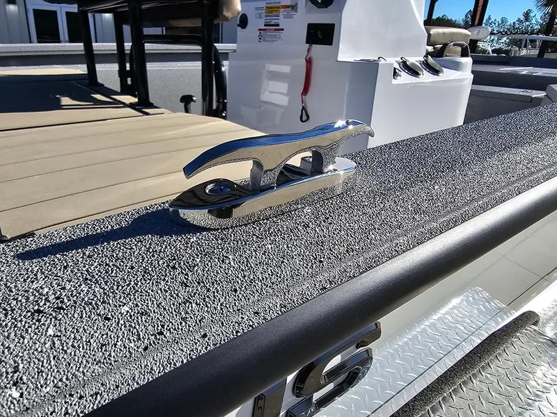 Slide: The Image of 2025 Vexus ACX2150 boat deck with chrome cleat and textured surface. - 25