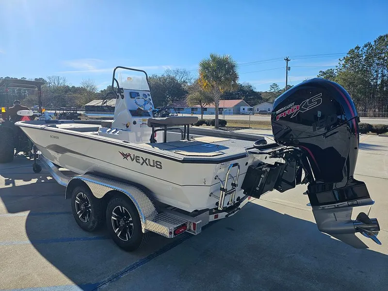 Slide: The Image of 2025 Vexus ACX2150 boat on trailer with powerful outboard motor in sunny outdoor setting. - 7