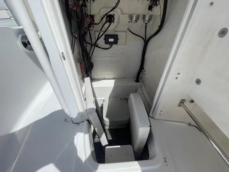 Slide: The Image of 2012 Robalo 180 CC boat interior with wiring and storage compartment. - 15