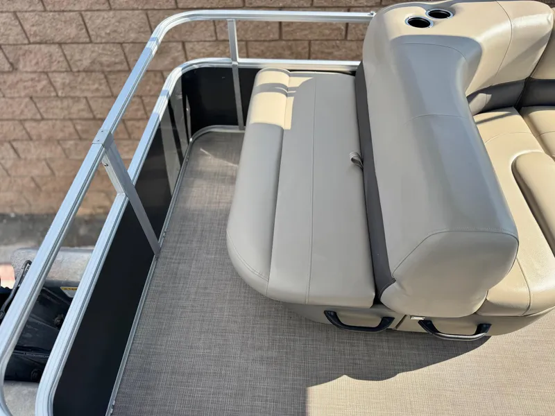 Slide: The Image of 2024 Sun Tracker Party Barge 18 DLX pontoon boat with beige seating and cup holders. - 15