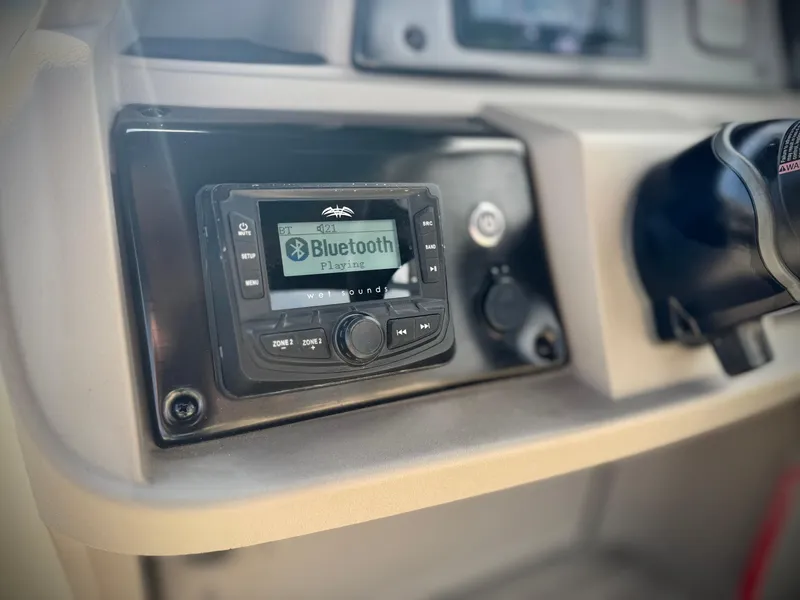 Slide: The Image of 2024 Sun Tracker Party Barge 18 DLX dashboard with Bluetooth stereo system. - 20