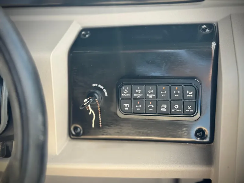 Slide: The Image of Control panel of 2024 Sun Tracker Party Barge 18 DLX boat. - 22