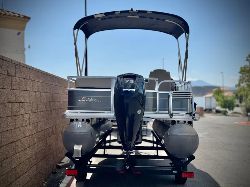 Slide: The Image of 2024 Sun Tracker Party Barge 18 DLX pontoon boat with canopy and outboard motor. - 4