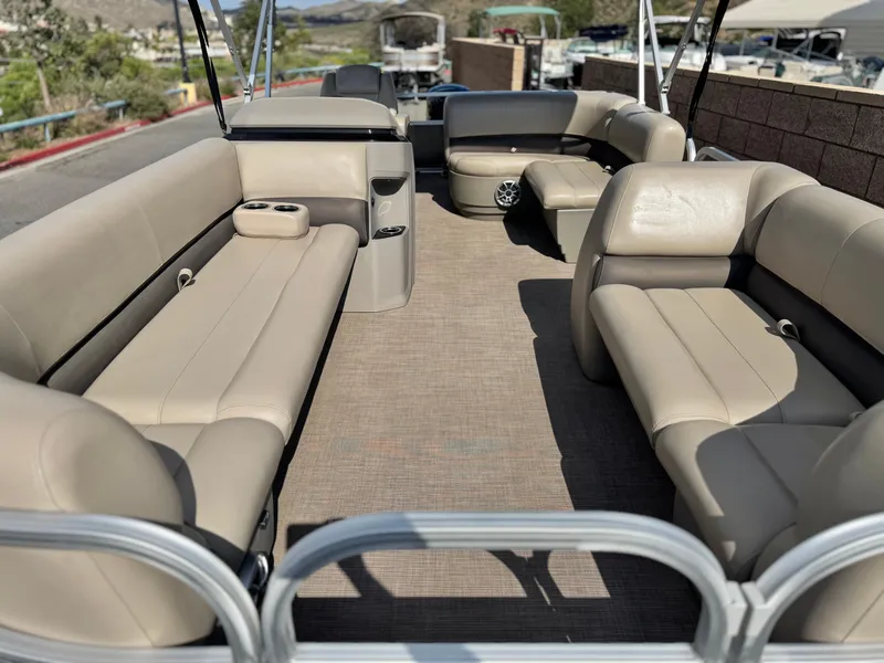 Slide: The Image of 2024 Sun Tracker Party Barge 18 DLX with spacious seating and beige upholstery. - 7