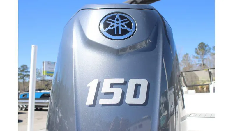 Slide: The Image of Outboard motor on 2025 Starcraft SVX 210 OB DC boat, featuring Yamaha 150 horsepower engine. - 13