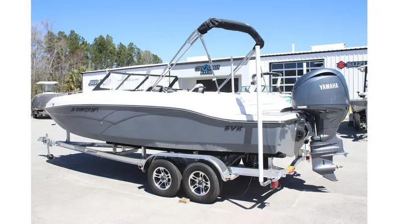 Slide: The Image of 2025 Starcraft SVX 210 OB DC boat on trailer with Yamaha outboard motor. - 2