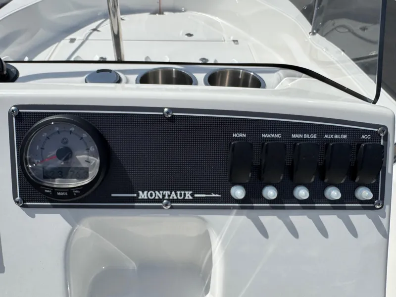 Slide: The Image of Control panel of 2022 Boston Whaler 170 Montauk boat with switches and gauge. - 10